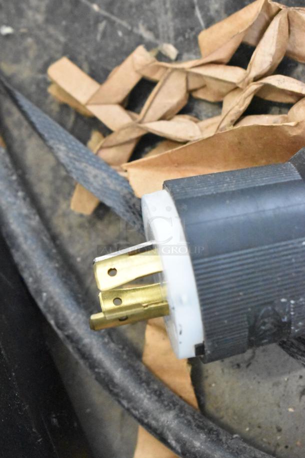 Close-up of an industrial power plug for a Precision HD-60 dough mixer, 220V, 3-phase connection, and cabling.