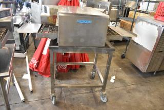 Turbochef HhC1618 stainless steel conveyor oven on stand, 208/240V, 1 phase, commercial countertop model, used condition.