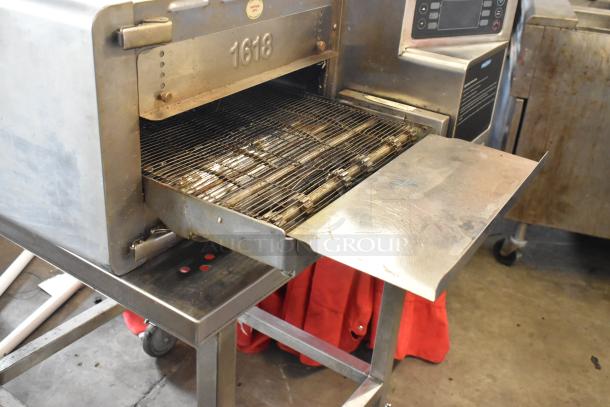 Turbochef HhC1618 stainless steel rapid speed conveyor oven on stand, 208/240V, used condition.