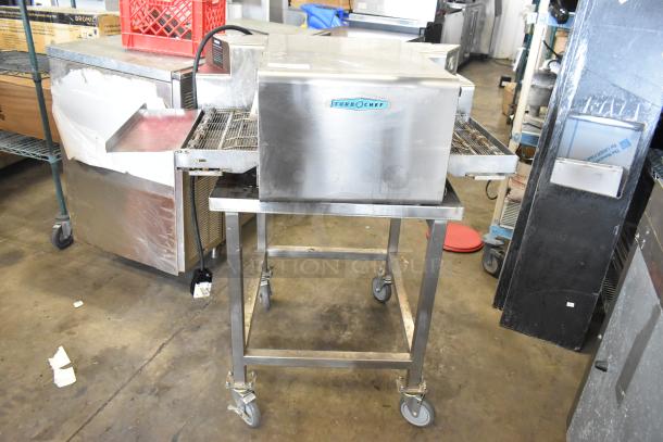 2022 Turbochef HhC1618 stainless steel rapid speed conveyor oven on stand with casters; in good condition.