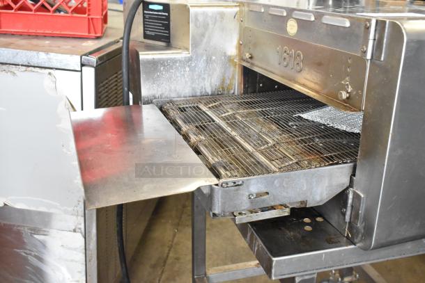 2022 Turbochef HhC1618 stainless steel commercial conveyor oven. Includes stand with casters. 208/240V, 1 Phase.