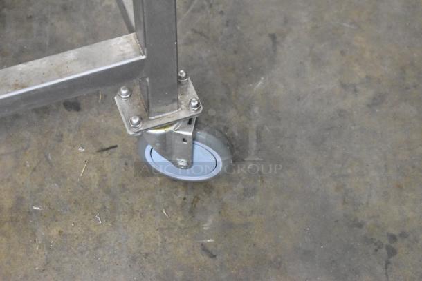 Turbochef HhC1618 conveyor oven caster on stainless steel equipment stand; shows mobility feature.