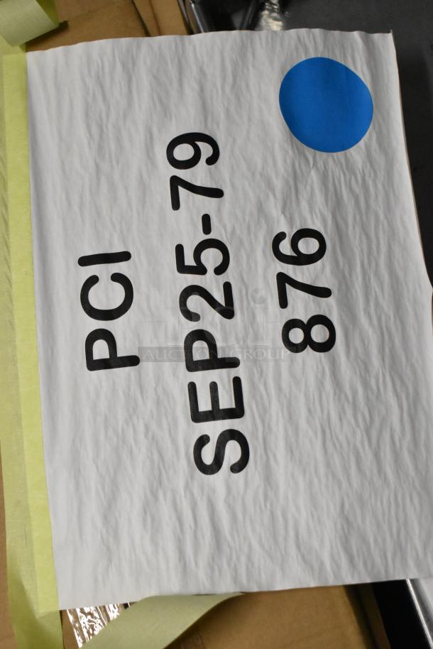 Cardboard packaging with handwritten markings "PCI SEP25-79 876" and a blue sticker.