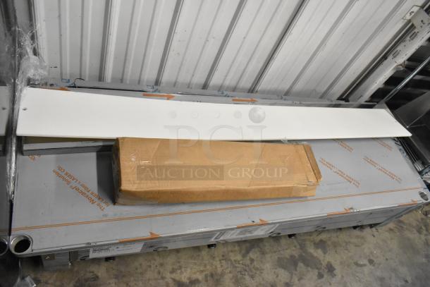 Advance Tabco SW-4E-120 four pan electric hot food table, brand new with minor scratches. Includes undershelf, packaging visible.