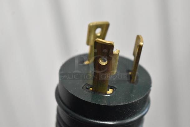 Close-up image of an electric plug designed for the Advance Tabco SW-4E-120-X hot food table, showing brass prongs.