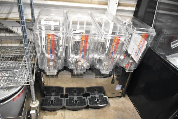 BRAND NEW Carnival King 382RBD5G4 5-Gallon Quadruple Refrigerated Beverage Dispenser; display shows max levels; minor cosmetic dents.
