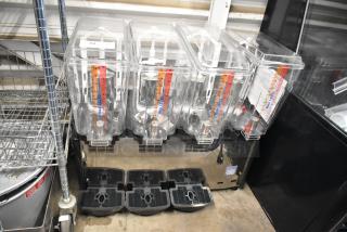BRAND NEW Carnival King 382RBD5G4 5-Gallon Quadruple Refrigerated Beverage Dispenser; display shows max levels; minor cosmetic dents.