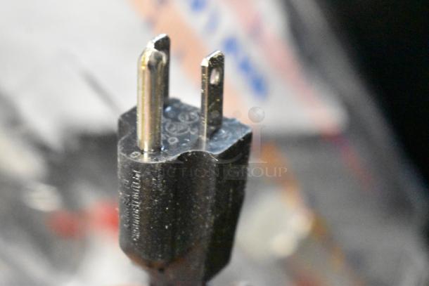 Close-up of a three-prong plug for Carnival King 382RBD5G4 Refrigerated Beverage Dispenser, 115 Volts, 1 Phase.