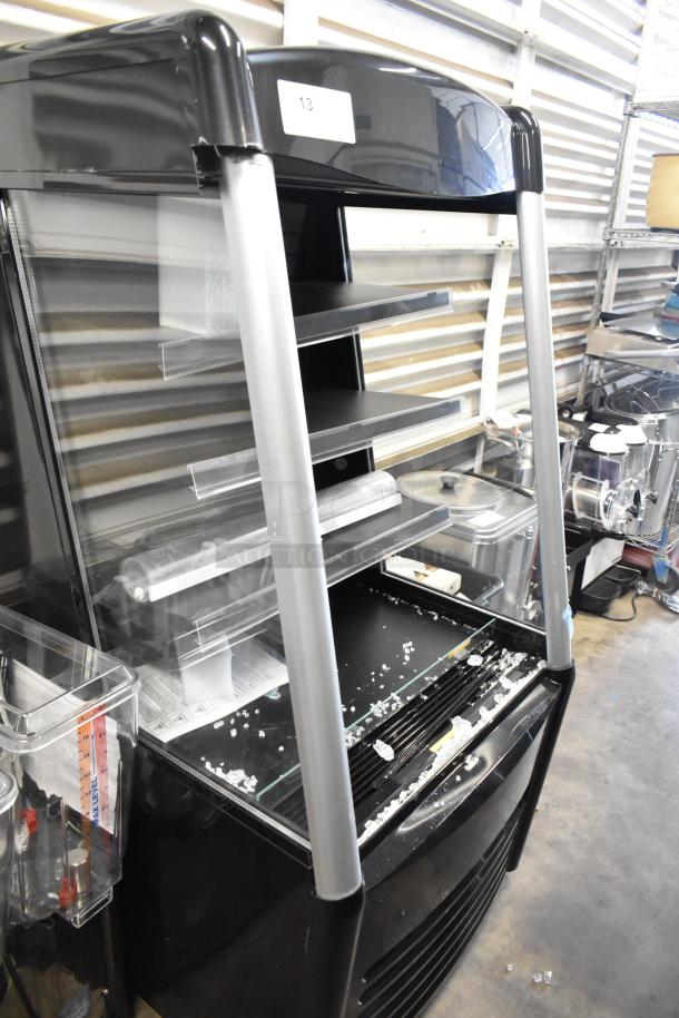 Brand new Avantco 193MAC26HCB 28" black vertical air curtain merchandiser, visible minor damage, on commercial casters. 115V, 1 phase.