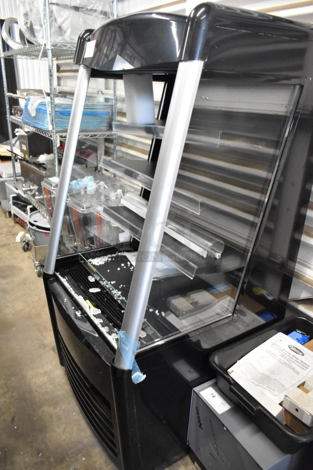 Brand new Avantco 193MAC26HCB 28" black vertical air curtain merchandiser, features commercial casters, 115V, scratch and dent.