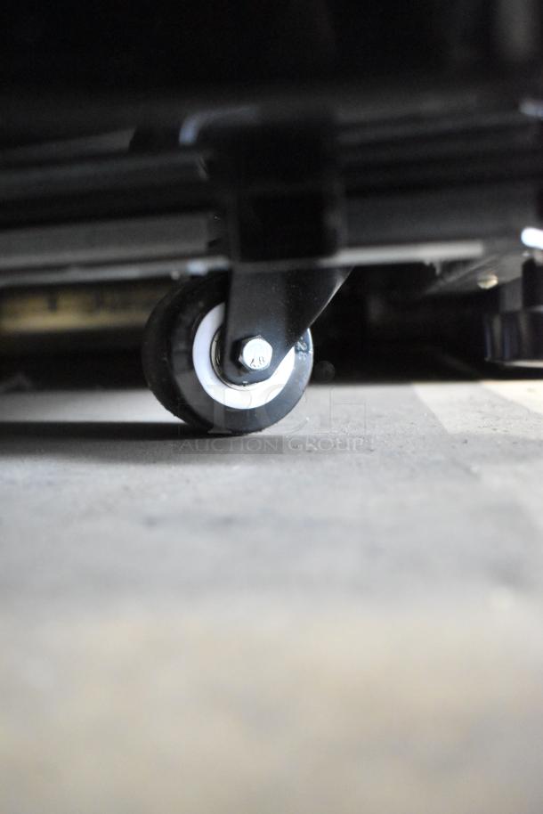 New Avantco 193MAC26HCB 28" black vertical air curtain merchandiser caster. Scratch and dent. 115V, 1 phase.