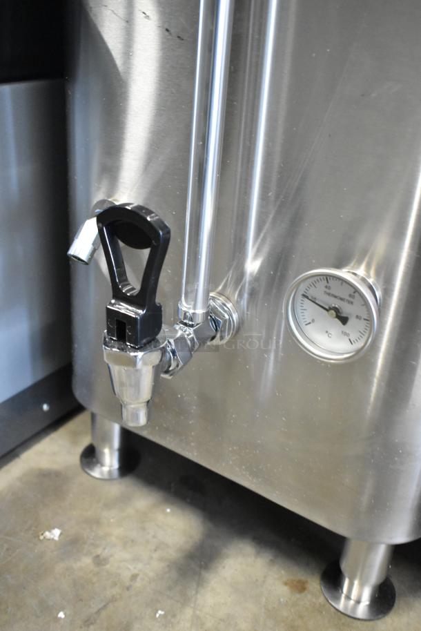 Brand new Avantco 177HWD10D stainless steel 10-gallon hot water dispenser, features visible scratches, thermometer, and spout.