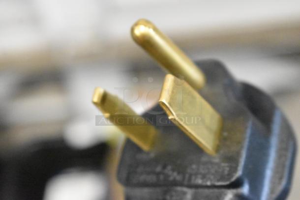 Close-up of a power plug from the Avantco 177HWD10D commercial hot water dispenser.