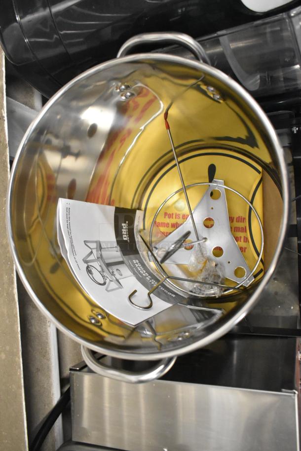 Brand new Backyard Pro BP30-ALKIT 30 Qt. aluminum turkey fryer/seafood boiler kit, 55,000 BTU, some dents visible.