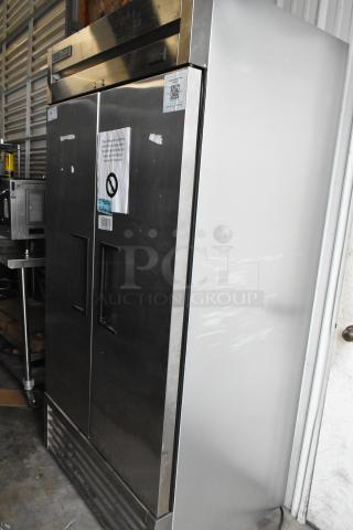 2022 True T-35-HC stainless steel 2-door commercial cooler with poly coated racks. 115 volts, 1 phase. Visible label.