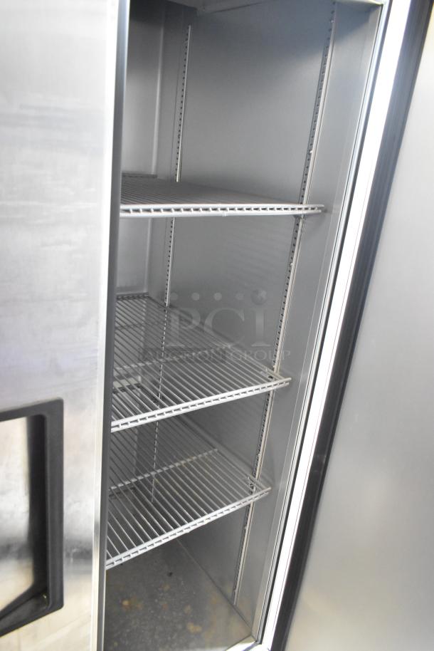 2022 True T-35-HC stainless steel commercial 2-door cooler, poly-coated racks, 115V, excellent condition.