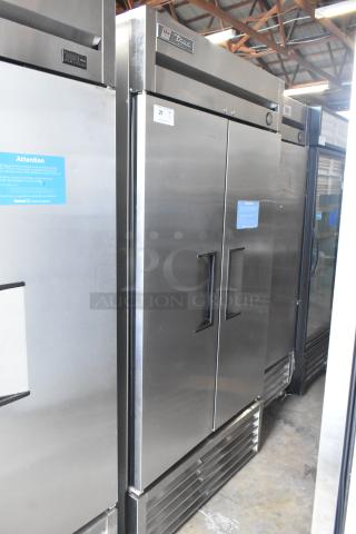 2016 True T-35 Stainless Steel Commercial 2 Door Reach-In Cooler with poly coated racks and commercial casters. Model T-35.