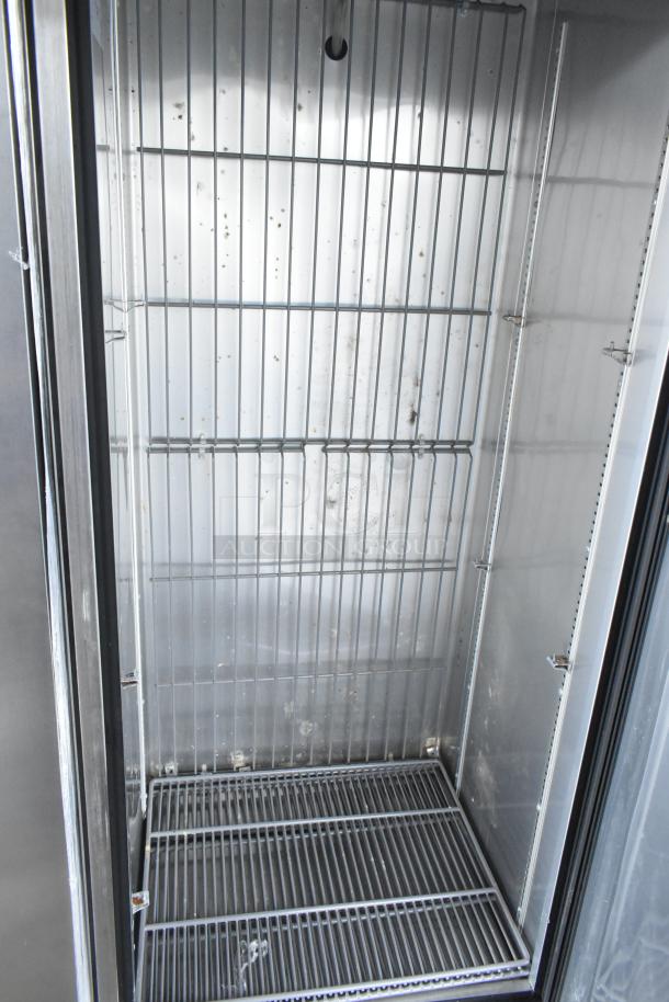 2017 True T-19F stainless steel commercial single door reach-in freezer with poly coated racks and commercial casters.