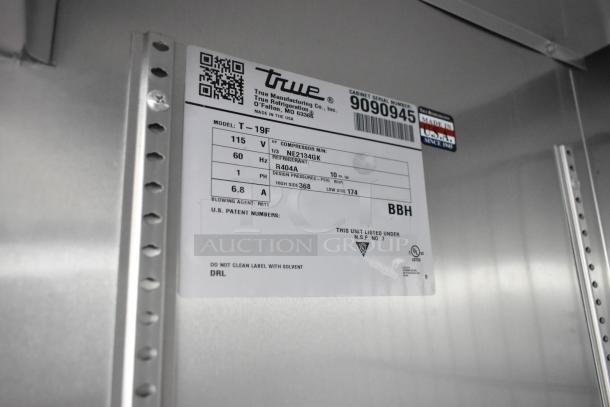2017 True T-19F stainless steel reach-in freezer, commercial casters, model info visible, 115V, 1 Phase, poly-coated racks.