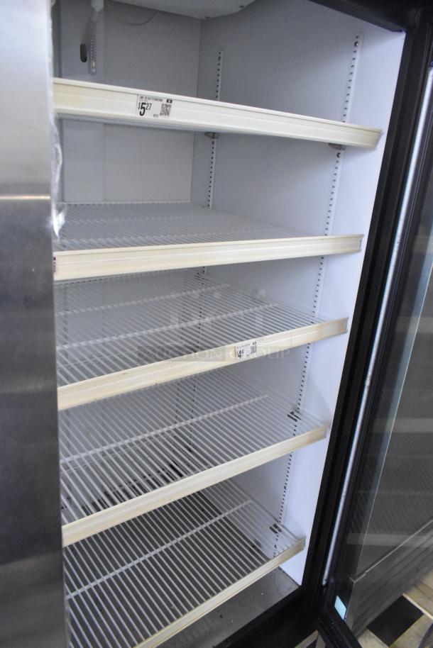 2024 True GDM-26-HC commercial cooler, single door, metal exterior, poly-coated racks, 115V, 1 phase, price labels visible.