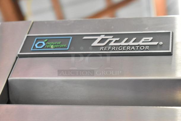 2018 True T-35-HC stainless steel commercial 2-door cooler, features poly-coated racks, “natural refrigerant” label shown.
