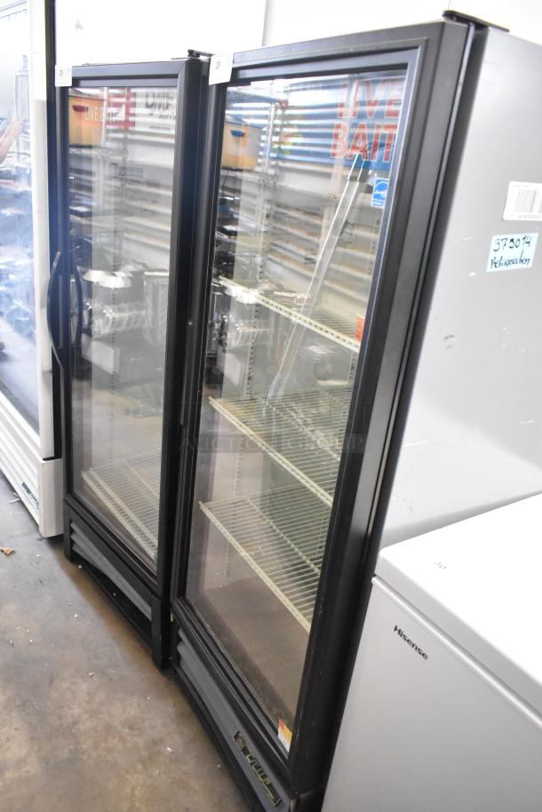 True GDM-12 metal commercial single door reach-in cooler, poly-coated racks, 115 volts, 1 phase, displayed in good condition.