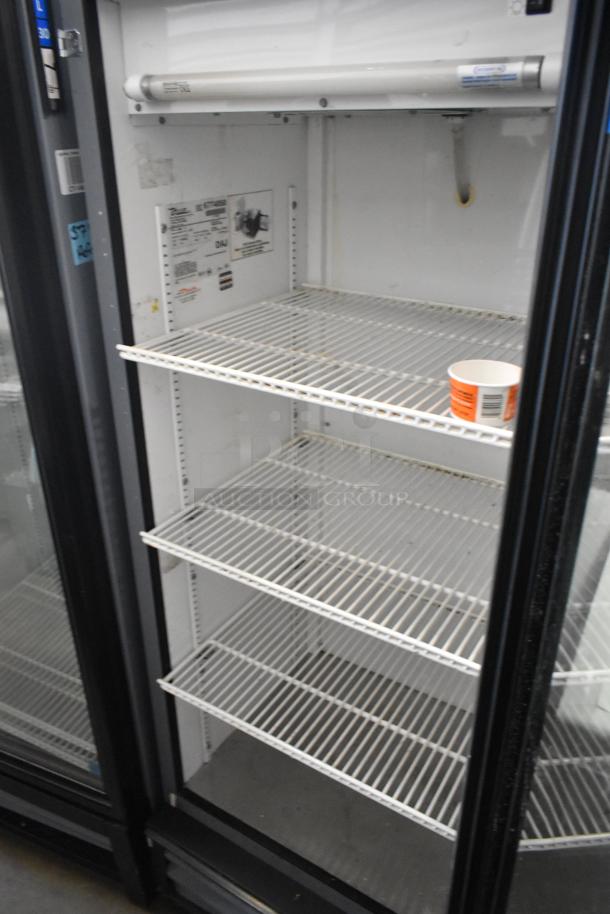 True GDM-12 commercial cooler with single glass door, poly-coated racks. 115 volts, 1 phase, metal body, clean condition.