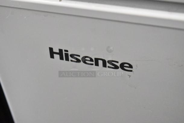 Hisense WFC050M6XWD metal chest freezer with hinge lid, 115 volts, 1 phase, logo visible on white surface.