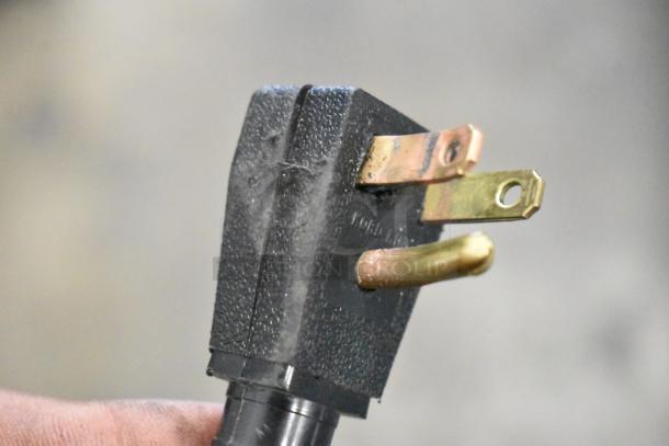 Close-up of a three-prong plug for the Hisense WFC050M6XWD chest freezer. 115 Volts, 1 Phase.