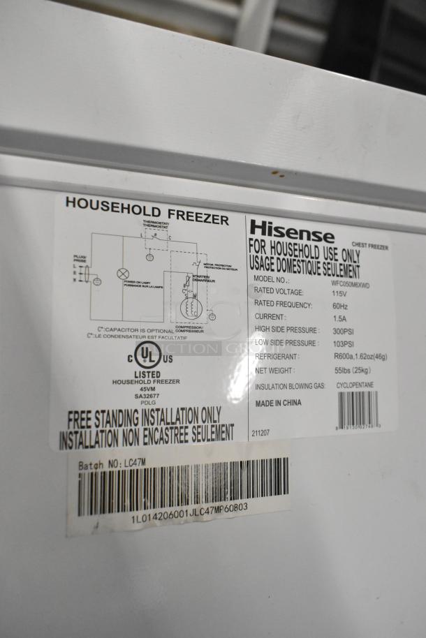 Hisense WFC050M6XWD chest freezer label with specs: 115V, 60Hz, 1.5A, 55 lbs, R600a refrigerant. For household use only.