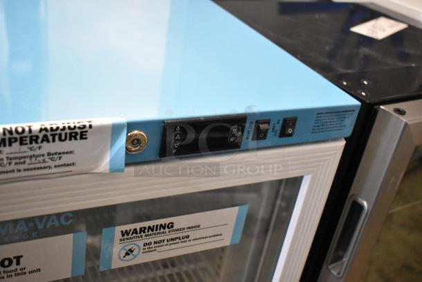 Two metal mini cooler merchandisers, Accucold ARG3PV and Arctic King ARV115B1AST, with temperature controls and warning labels.