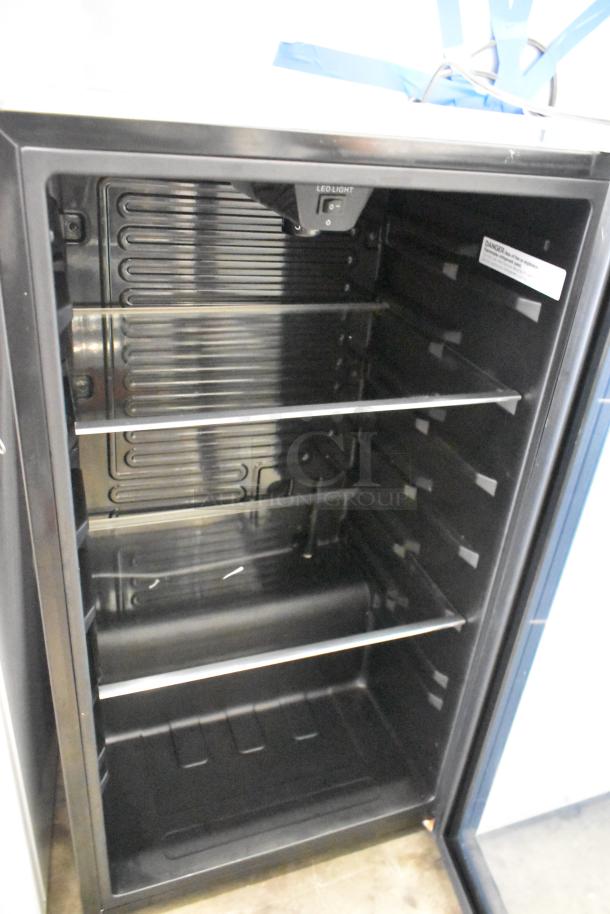 2 Metal Mini Cooler Merchandisers, Accucold ARG3PV, Arctic King ARV115B1AST, 115V, 1 Phase, shelves visible, open door.