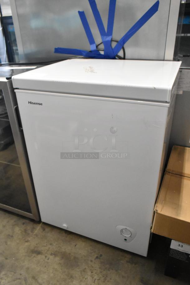 Hisense WFC050M6XWD metal chest freezer with hinge lid, 115 volts, white exterior, visible Hisense logo.