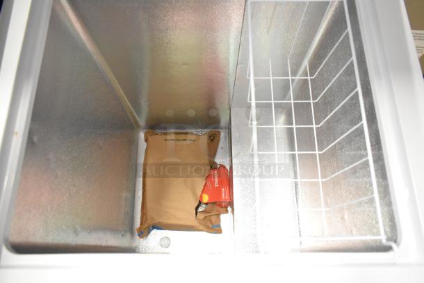 Hisense WFC050M6XWD metal chest freezer, hinge lid open, empty with a wire basket. 115 Volts, 1 Phase.