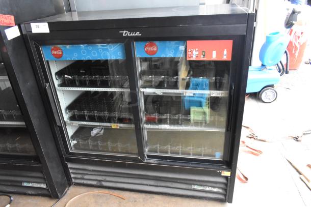 2019 True GDM-41SL-48-HC-LD commercial cooler; two-door, poly-coated racks, 115V, 1 phase, Coca-Cola branding visible.