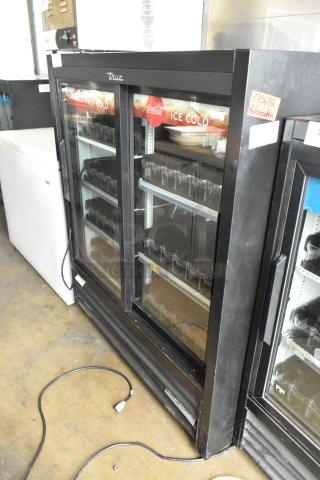 2020 True GDM-41SL-54-HC-LD commercial cooler, 2-door reach-in, poly-coated racks, 115 volts, good condition.