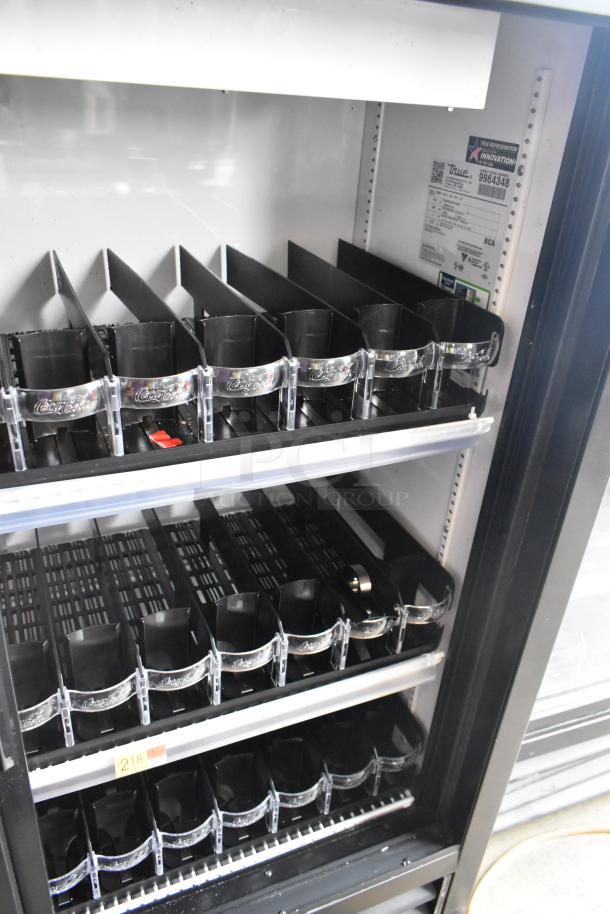 2020 True GDM-41SL-54-HC-LD commercial 2-door cooler, poly-coated racks, metal frame. Model tags visible, 115 volts, 1 phase.