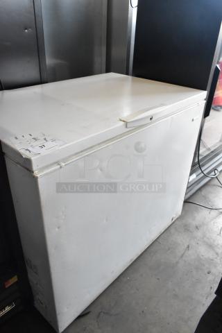 Kenmore 253.16342105 metal chest freezer with hinge lid, white finish. Visible dents and scratches, 115 volts, 1 phase.