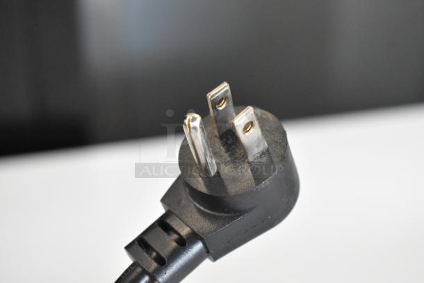 Close-up of a Kenmore chest freezer power plug, 115 volts, three-pronged for model 253.16342105.
