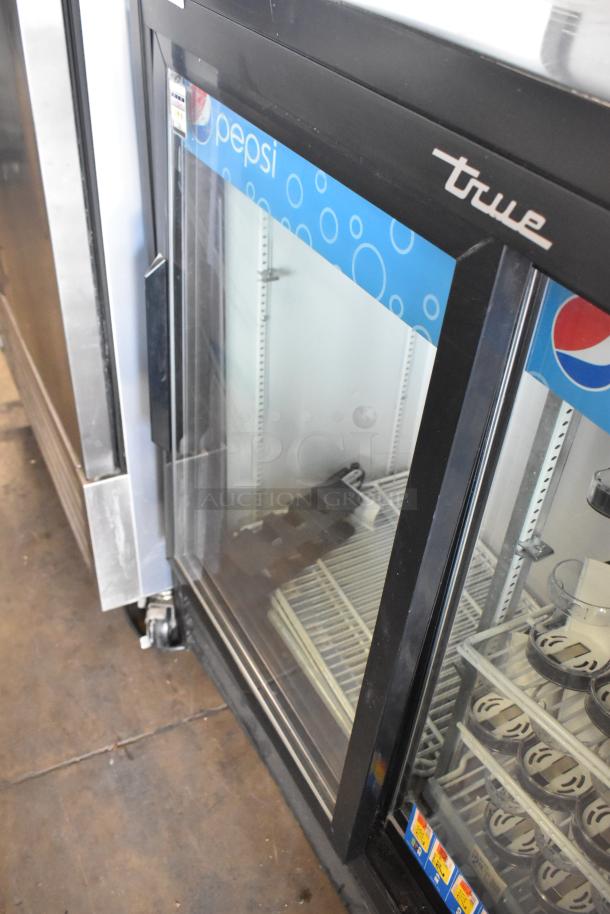 2019 True GDM-41SL-48-HC-LD 2-door cooler with Pepsi branding, poly-coated racks, and glass doors. Good condition.