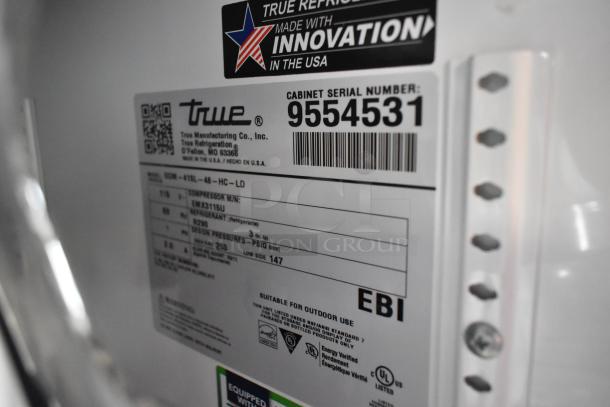 True GDM-41SL-48-HC-LD cooler label showing model, serial number 9554531, and specs. Made in USA marking visible.