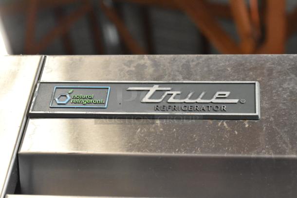 2018 True T-35-HC stainless steel 2-door cooler, poly coated racks, on commercial casters. Label shows "natural refrigerant."