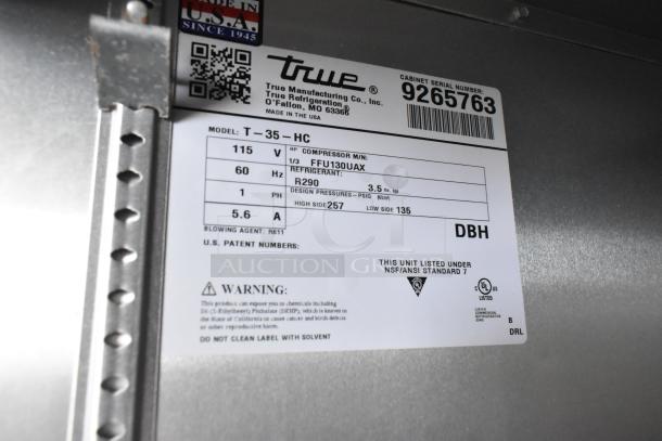 2018 True T-35-HC 2-Door Reach-In Cooler, stainless steel, poly-coated racks, on commercial casters, 115V, in excellent condition.