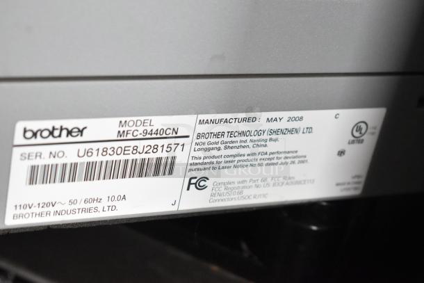 Brother MFC-9440CN multifunction machine; scanner, copier, printer, fax. Model label shows FCC compliance, made May 2008.