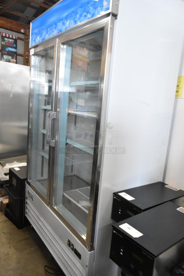 Brand new 2023 Avantco 178GDC40HCW 48" white glass door merchandiser fridge with LED lighting, poly-coated racks, commercial casters.