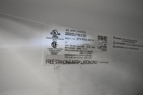 Label on General Electric mini cooler model GDE03GLKBLR, 115V, lists specs and installation instructions.