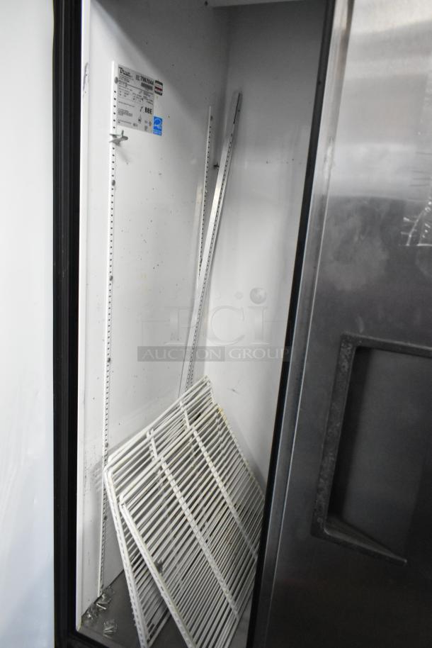 True T-35 Stainless Steel Commercial Cooler with poly-coated racks, open door view. Features voltage label and clean interior.