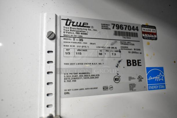 True T-35 cooler label showing model, voltage 115V, phase 1, energy efficiency, and NSF certification. Made in USA.