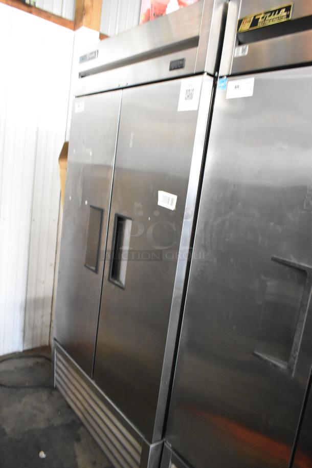 2024 True T-35 stainless steel commercial cooler with 2 doors, poly coated racks, on casters. 115 volts, 1 phase.