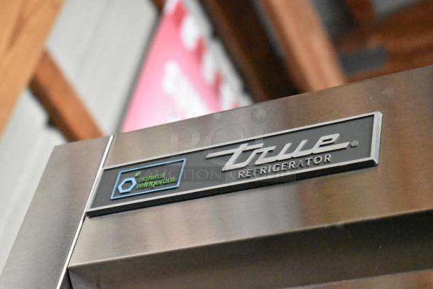 2024 True T-35 stainless steel reach-in cooler with 2 doors, poly-coated racks, commercial casters; features natural refrigerant label.
